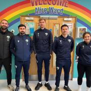 TNS players and officials at Gobowen's RJAH Hospital this week.