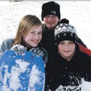Enjoying sledging at Gatacre, Oswestry, pictured, from left are Alisha Griffiths, Henry and Isaac Isles.