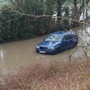 Blue BMW stuck in Gobowen Road flood water.