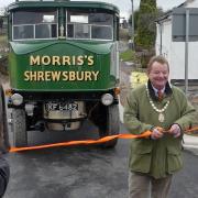 Cllr Vince Hunt cuts the ribbon for the opening of Schoolhouse Bridge as Michael Limbrey looks on.