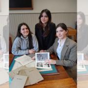 Lower sixth pupils Sofija, Vladana and Annamaria browsing through some of the school's old copies of the Oswestrian magazine dating back to the late 1880s.
