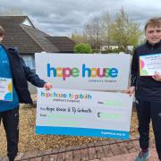 Williams Jones and Josh Stevenson with their cheque for Hope House.