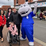 Hope House area manager Lindy Welch-Smart, head of retail Suzanne Cumming, Wrexham FC’s Luke Young, Hope House Hippo and Amelia Thompson.