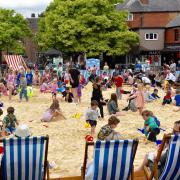 People enjoying the 2024 Festival Square beach courtesy of Oswestry BID.