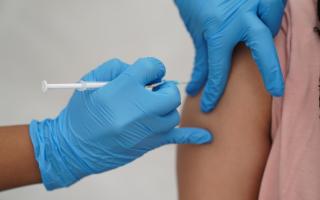 File photo dated 31/07/21 of a person receiving a Covid-19 jab. Hundreds of thousands of care home residents, staff and housebound people in England will receive their autumn coronavirus vaccine booster from Monday, with millions more people in line in