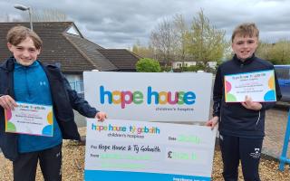Williams Jones and Josh Stevenson with their cheque for Hope House.